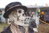 Two skeletons stand guard outside the Hammonds' residence in
Palmer. The house at 855 Josh Drive is highly decorated in the
spirit of Halloween and will give any young trick-or-treater a good