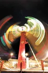 ROBERT DeBERRY/Frontiersman The lights of the newest ride at the
Alaska State Fair, The Apollo, streak to form a circle as the ride
goes inverted and around 360 degrees in this extended expos