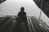 U.S. Air Force Staff Sgt. Carrie Scott, loadmaster, 517th Airlift Squadron, Joint Base Elmendorf-Richardson, Alaska, waits to conduct an airdrop on a C-17 Globemaster III aircraft in support 