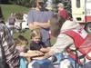 Photo courtesy NAOI Red Cross Volunteers at the Emergency
Preparedness Fair help residents practice CPR.