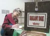 Billie Blanchard fills out her Matanuska Electric Association
ballot Tuesday evening at the annual board meeting at Raven Hall on
the Alaska State Fairgrounds. (ROBERT DeBERRY/Frontiersman)