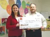 Wells Fargo Mat-Su district manager Aryne Randall presents CCS
Early Learning Executive Director Mark Lackey with a $3,000
donation to support Head Start preschool programs in the Mat-Su
Vall