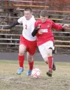 Wasilla’s Rayce Cole fights for possesion during a 4-2 loss to
Juneau-Douglas at Wasilla HIgh earlier this month. Cole and the
Warriors will face the Crimson Bears once again, but this time i