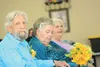 Groom Marvin Van Buskirk, 84,  bride Bonnie Jennings, 79,  and maid of honor Mary Anderson listen to the pastor during the Van Buskirk-Jennings wedding at the Wasilla Senior Center July 18, 2