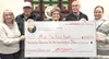 Three Bears Alaska raised $111,912 to be redistributed to those in need across the state. Pictured left to right: Cheryl Metiva, Director of Marketing- Three Bears Alaska; Fred Becker, Execut