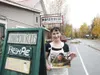 Photo courtesy Laura Wright Talkeetna Roadhouse owner Trisha
Costello stands holding a signed picture of 'Man v. Food' host Adam
Richman.