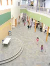 GREG JOHNSON/Frontiersman Fred and Sara Machetanz Elementary
School is the first of its kind in Alaska. The brightly lit atrium
soars to 39 feet in height and a movable wall can create
educat