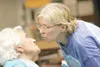 ROBERT DeBERRY/Frontiersman Elann Moren, right, gives her
mother, Harriet Hansen, a kiss while they visited this week.