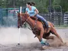 Rose Christi and her horse Cody turn up some dust as they complete the first pass through a line of poles during a 907 Barrel Racers Association’s Barrel Racing and Pole Bending event at the 
