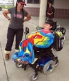 Tina Ervin, left, and her son, Austin, 7, smile outside Swanson Elementary in Palmer, where Austin showed off a new customized "Spidey Bus" for his classmates on Friday, August 21, 2015. Aust