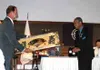 Palmer Mayor Jim Cooper accepts a decorative fan from Saroma
Mayor Jiro Hori. Photo by DANIEL SPOTH/Frontiersman.