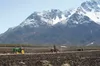 A trio of antique tractors and their owners work to plow 40 acres of farmland in the Butte Saturday. Farmer John Hett hosted members of the Antique Power Club of Alaska for their 15th annual 