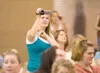 ROBERT DeBERRY/Frontiersman Jessica Cox takes video of the
Iditarod Elementary Mother's Day program put on by the school's
kindergarten classes.