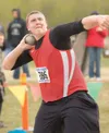 ROBERT DeBERRY/Frontiersman Wasilla senior John Knowles throws
the shot put 50-11 to take the Northern Lights Conference
Championships title Friday at Palmer High School.