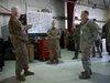 Lt. Gen. L. Scott Rice (left), director, Air National Guard, talks to Master Sgt. Sara Jones, 176th Operations Support Squadron, and Brig. Gen. Darrin Slaten, 176th Wing commander, about the 