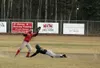 ROBERT DeBERRY/Frontiersman Wasilla senior infielder Chris
Bydlon prepares to catch the ball as Colony’s Aaron Butcher tries
to slide into second base during the Warriors’ 7-6 come-from-behin