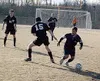 Colony senior striker Nick Van Kirk dribbles the ball around a
Nikiski defender in the Knights' 3-3 tie with the Bulldogs at
Colony High School on Friday. The game marked the season opener fo