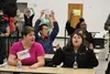Prosters sat at tables set for the legislators during the third day of the special session at Wasilla Middle School. Tim Rockey/Frontiersman