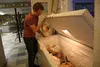 Frontline Mission program coordinator Matthew Sheets shows some of the frozen turkeys for this years Thanksgiving Dinner at the Menard Sports Center. Jacob Mann/Frontiersman