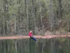 Pearl Weaver, of Palmer, careens down a zipline over “Reflection Pond”, while on a tour with Denali Zipline Tours. This line is the finale of a trip that includes nine zips, suspension bridge