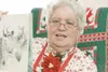 ROBERT DeBERRY/Frontiersman Mrs. Claus holds a book up as she
reads aloud at Saturday'€™s community celebration in Wasilla. Mrs.
Claus often mistaken for Valley resident Margaret Heaven said
