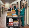 The team collected more than 1,300 jars of peanut butter during the second annual Jars of Love Peanut Butter Drive to help stock the shelves at Mat-Su Food Bank and Palmer Food Bank and fight