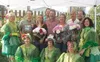 Mike and Paula Williams and their family posed with the "cabbage fairies" at the Alaska State Fair after being named Farm Family of the Year on Thursday, Aug. 21. The Williams run Eaglesong F