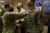 Col. Chris Landers, commander of 4th Infantry Brigade Combat Team (Airborne), 25th Infantry Division, congratulates Sgt. Cody Grant, for receiving the U.S. Army's Safety Guardian Award at Joi