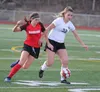 Wasilla’s Nicole Catlett tries to take the ball away from Colony’s Bella Brown during a 1-1 tie Tuesday at Wasilla High School. Jeremiah Bartz/Frontiersman