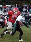 Wasilla nose guard Sam Widmer chases down Knight running back
Robert Conrad. Widmer led the Warrior defense to their first
shutout of the season. Photo by JEREMIAH BARTZ/ Frontiersman.