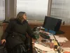 Janel Gagnon sitting at the Frontiersman publisher's desk.jpg