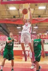 Wasilla senior Connor Devine slam dunks the ball during the first period action in a game against the Colony Knights. Devine was named the Gatorade Alaska Player of the Year. Robert DeBerry