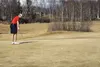 Jordan Miller of Anchorage watches a putt at Settlers Bay Golf Course on Friday, April 1. The course opened for the season Friday under sunny skies and temperatures in the 50s. STEVEN MERRITT
