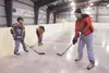 ROBERT DeBERRY/Frontiersman Rink manager Charles Jeska talks
about proper hockey stick grip during Monday’s beginner hockey
clinic at the new Big Lake Lions Recreation Center.