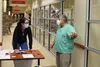 Dr. Anne Zink and Dr. Michael Alter prepare to give COVID-19 vaccines Dec. 18, 2020, at Mat-Su Regional Medical Center. Tim Rockey/Frontiersmam