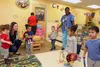 Staff at the Cooper Child Development Center take children through a marching dance Jan. 29, 2018, at Fort Sill, Okla. Army Emergency Relief will start offering up to $1,500 on Feb. 1 as part