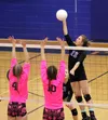 Palmer's Kristen Beames pushes a ball over a pair of Soldotna blockers during a 3-1 win over the Stars Thursday, Oct. 12, 2017, at Palmer High School. Jeremiah Bartz/Frontiersman