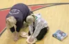 EMT Sally Beach shows Houston Middle School student Kari-Lynn
Heckathorn how to interlock her fingers and press down with the
heel of her palm while performing CPR. (HEATHER A.
RESZ/Frontiers