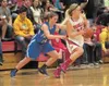 Palmer’s Caitlin Scott fouls Wasilla’s Alexis Imoe during the
final seconds of Wednesday’s game at Wasilla High School. Wasilla
came back from a 12 point deficit to beat the Moose 50-44. ROBE