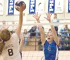 Palmer senior Kendal Venske blocks a shot during an early season
match against Grace Christian School. (ROBERT
DeBERRY/Frontiersman)