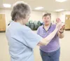 ROBERT DeBERRY/Frontiersman Tai Chi instructor Kathi Remsen,
right, works with Judy Swaney on proper technique Monday at the
Wasilla Senior Center.
