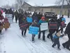 A group of participants in the Alaska Pro-Life March carry signs along the approximately one-mile route in downtown Palmer on Saturday, Jan. 28. MARY LOCKMAN/Frontiersman