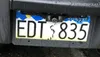 An Alaska license plate bearing several years’ worth of renewal stickers is seen Aug. 25, 2021, in Juneau. James Brooks/Alaska Beacon