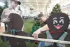 Volunteers Tanner Brown, 9,  and dad Clint decorate for the 2012 Christmas Friendship Dinner at the Curtis D. Menard Memorial Sports Center in Wasilla. Last year, the dinner fed about 4,000 p