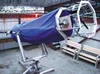 A 26-foot Newtonian telescope rests in the observatory at
Burchell High School. A right, Burchell teacher Tim Lundt looks
over the telescope as it pokes through the retractable roof of the
St