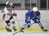 Kenai Central's Noah Hallam and Palmer's Tavian Mukaabya battle for the puck Thursday, Nov. 16, 2023, during Kenai River Cup play at the Kenai Multi-Purpose Facility in Kenai, Alaska. Jeff He
