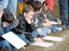 Students of Michael Carson's third grade class (above) takes
notes during the game. Photo by JEREMIAH BARTZ/ Frontiersman.