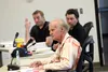 Mat-Su Borough Assemblyman Jesse Sumner raises his hand as fellow members Tim Hale and Geroge McKee look forward during budget deliberation. Tim Rockey/Frontiersman