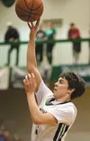 Colony's Anton Chamblee puts the ball up for two points during the championship game against the Kodiak Bears at the Northern Lights Conference Championships Saturday at Colony High School. R