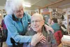 Dorthea Taylor jokes with husband George Murphy during Taylor’s 86th birthday celebration. Taylor fended off an agitated moose with a shovel after it attacked her husband while he was walking